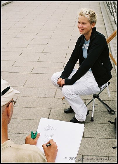 There are lots of pavement artists everywhere in London Town, and this one was plying his trade on the millennium bridge. I think his subject is more of a caracterature in the flesh than he could possible draw her.<br />*<br />*