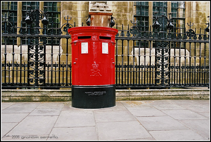 I don't have to tell you that this is a Royal Mail box, commissioned during the reign of Elizabeth II, the present monarch. Made of solid cast iron, it weighs near a ton and will last forever. The cast iron railings behind it are Victorian.<br />*<br />*